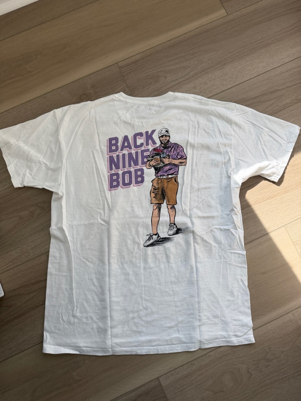 Back Nine Bob Men's White Graphic Tee with Purple Print